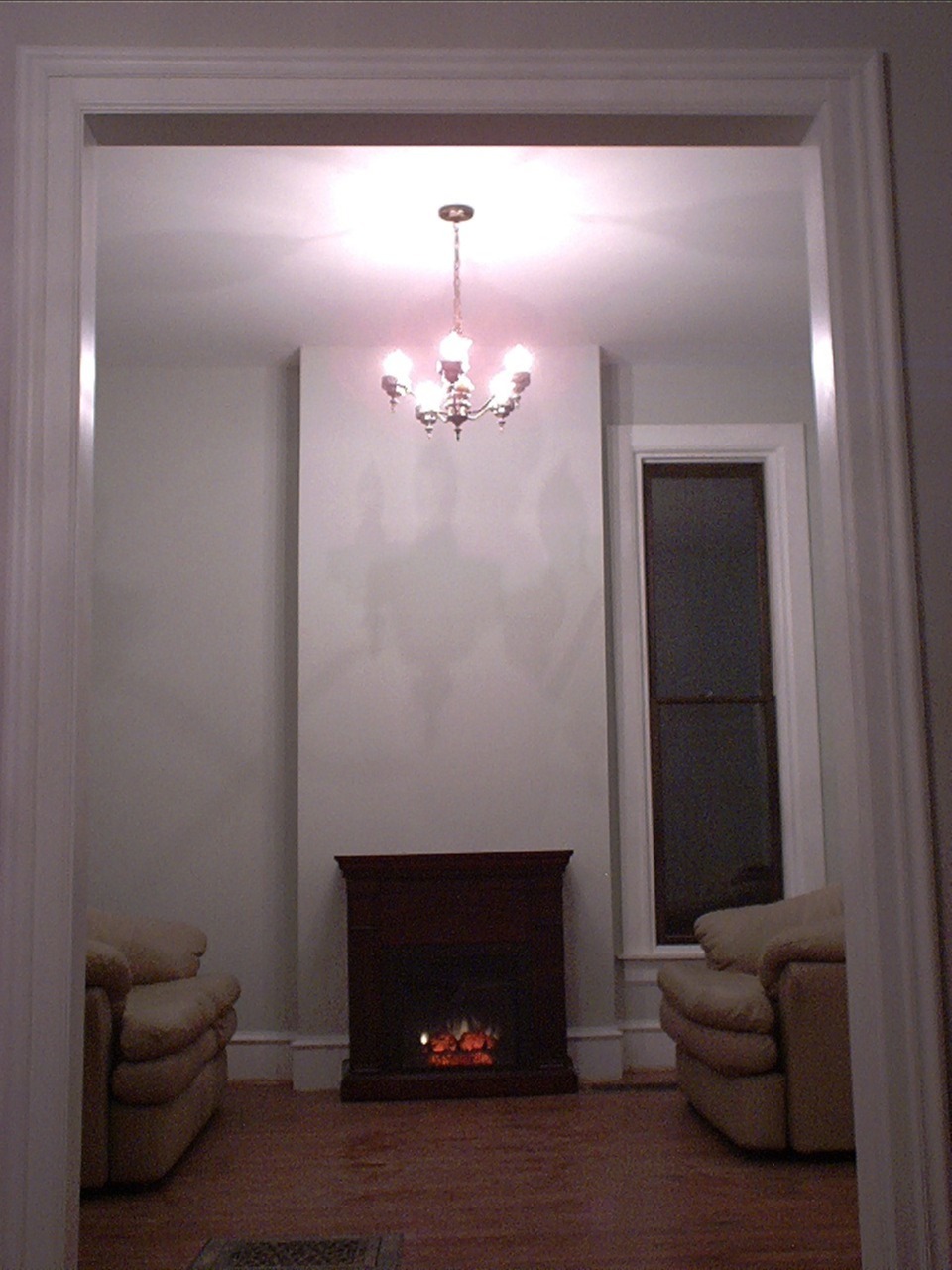 Victorian library with fireplace at 1908 Maple Ct